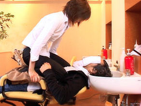 Asian model is a hairdresser in a sexy salon for men
