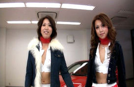 Two Racing Queens Take Turns Posing and showing Pussy by the Car